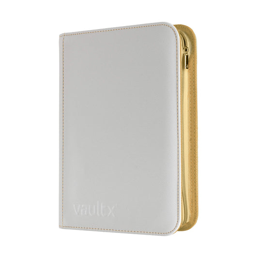 A Vault X zippered binder in white with gold stitching and zip, shown on a plain white background.